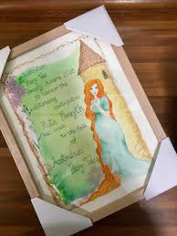 A framed artwork showing a lady with hair to the ground standing by a tower, awarding the 2018 AFTS Award to Kate Forsyth.