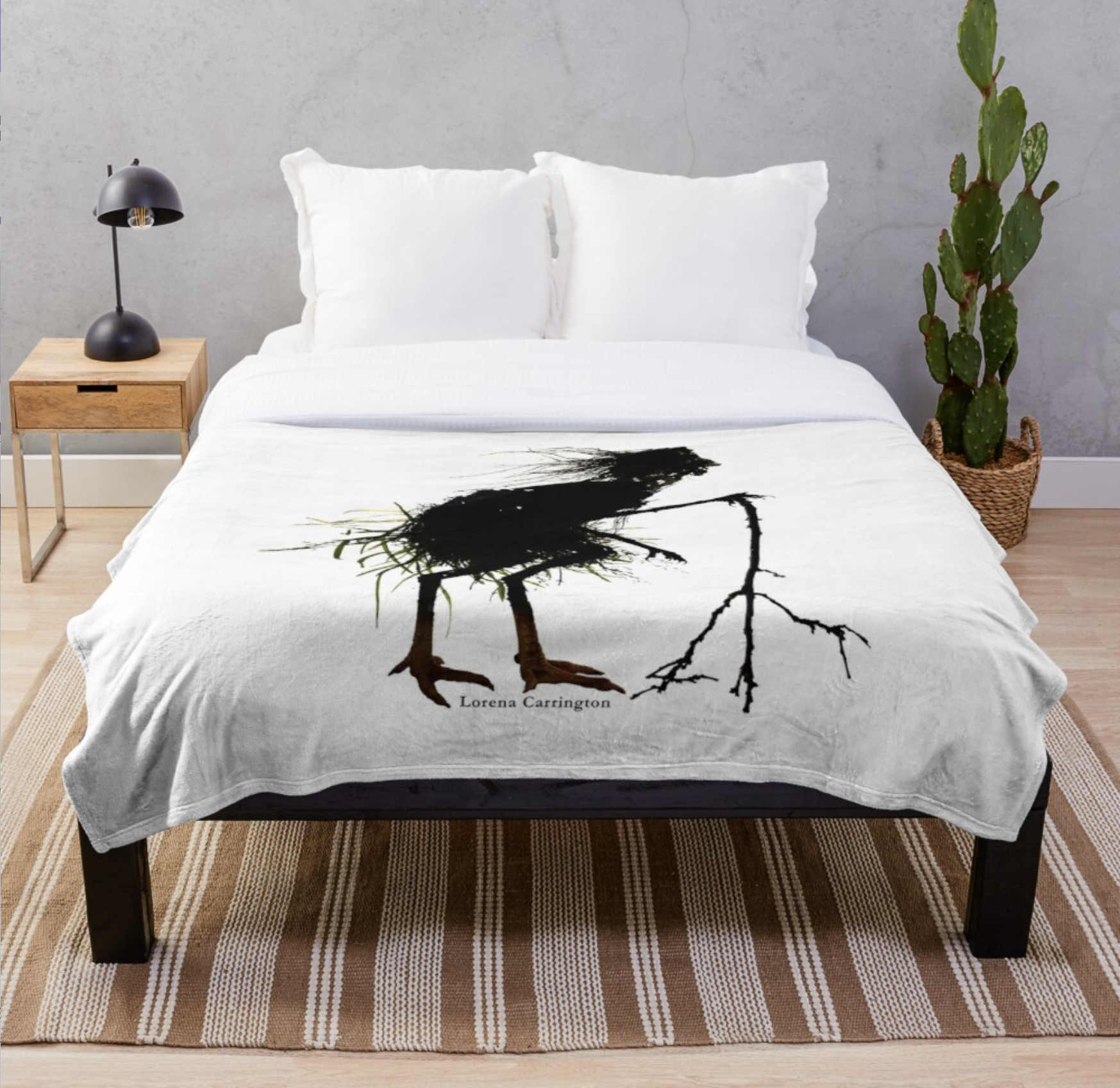 Simply furnished bedroom features quilt laid on double bed. The quilt has a dramatic silhouette of a grassy woman with chicken legs leaning on a three-pointed crooked stick.
